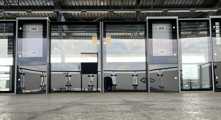 Modern Urban Train Station Platform with Glass Doors and Steel Structure in Contemporary Architectural Design