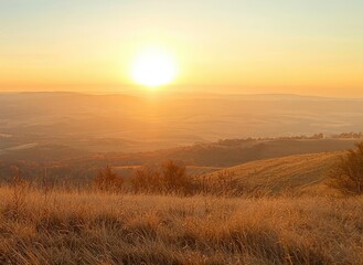 Person celebrating at sunset on a hilltop with open arms.