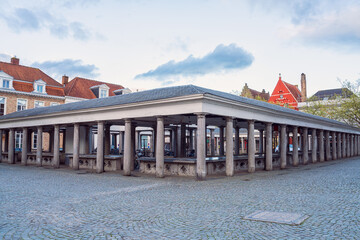 Old Fish market (Vismarkt) in Bruges, Belgium. Scenic cityscape with historical and architectural landmark located in the city center near the Groenerei canal, outdoor travel background