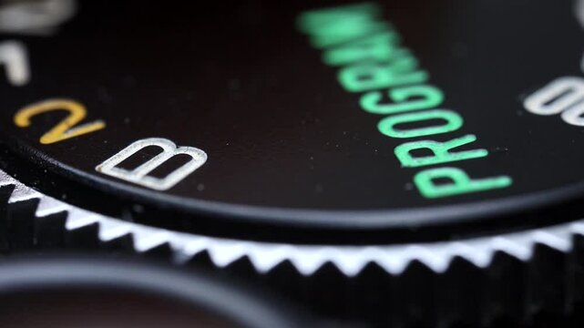 Vintage camera control ring. Shutter speed dial rotation. Film camera settings