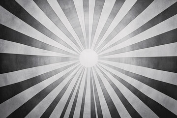 A monochrome radial pattern of dark and light lines emanating from a central point, giving a dramatic sense of light and depth
