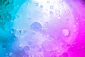 Creative multicolored gradient background with oil drops.