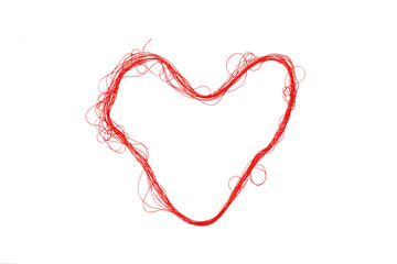 Red heart shaped thread on white background