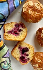 freshly baked blueberry muffins with almond flakes crumble topping, overhead view