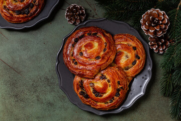 Pain aux raisins, also called escargot or pain russe, is a spiral pastry with custard cream and...