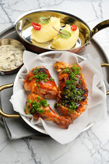 Fried Chicken in tomato sauce with mashed potato and sauce