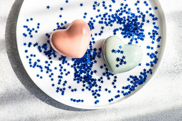 Romantic table setting with hearts and star confetti