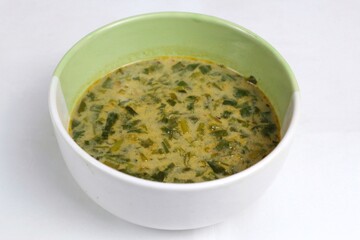 Spinach vegetable porridge is served in a bowl