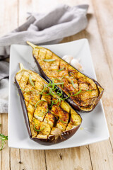 grilled eggplant with oil and herbs, perfect for healthy meals and Mediterranean cuisine. Ideal for vegetarian and plant-based dishes