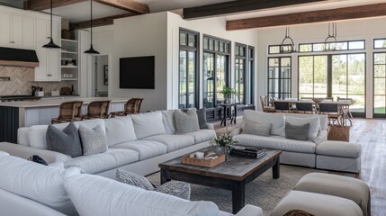 Fototapeta premium Modern Farmhouse Living Room with White Couches and Exposed Wooden Beams