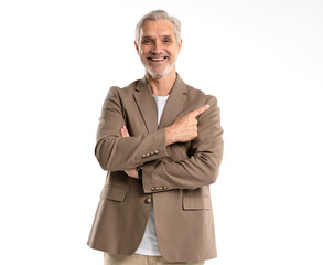 Smiling mature 40s old businessman with grey hair beard in casual shirt, pointing at copy space for...