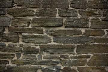 wall of flat stones as a background, close up
