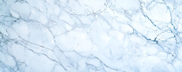 Obraz premium Elegant light blue marble texture with subtle veining, perfect for backgrounds, wallpapers, or design projects.