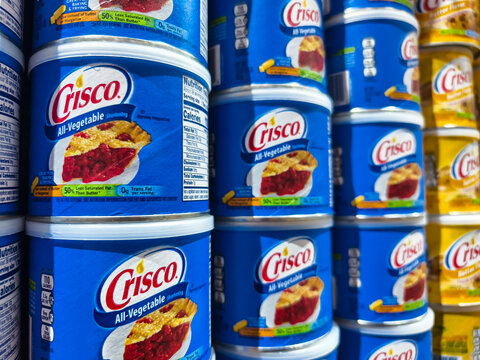 Crisco all-vegetable shortening cans displayed on supermarket shelf