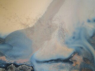 Aerial view of birds flying over a colorful landscape