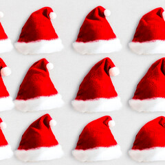 Seamless Christmas Background with Santa Claus Hats on White - Festive Holiday Pattern for Seasonal Designs and Decorations