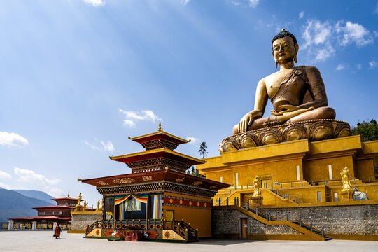 Majestic Buddha Dordenma Statue against the background of a blue sky. Bhutan