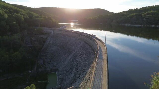 Aerial Landing next to Dam Pant&agrave; de Foix at Sunset 4k drone