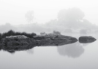 Fototapeta premium Serene misty landscape with reflections