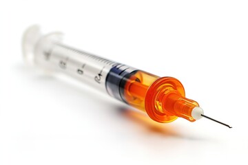 Syringe with orange plunger and needle isolated on a white background for medical use