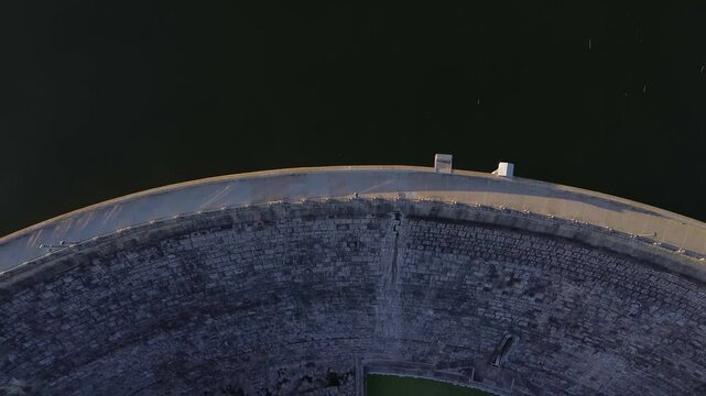 Aerial Top-Down Reveal of Pant&agrave; de Foix at Sunset 4k drone