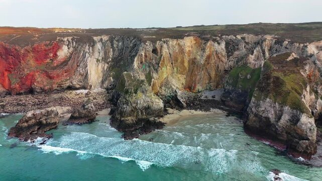 Aerial view of rocky cliffs overlooking sea at St Agnes Heritage Coast in Cornwall, Perranporth