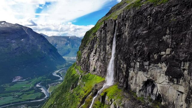 Drone view of the Seven Sisters Waterfall flowing on mountain along the Geirangerfjorden in Norway