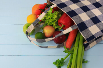 Groceries in eco bags with vegetables Which shopping bag and cotton shopper as eco friendly, flat lay as  sustainable lifestyle concept. zero waste food shopping. plastic free items