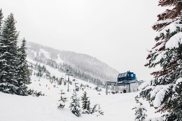 Blue ski lift with skiers in Cascade Mountains