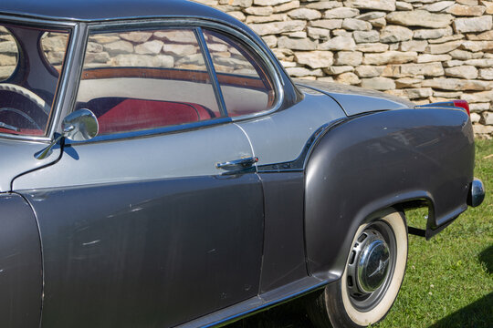 Vintage 1950s borgward isabella coupe parked by stone wall
