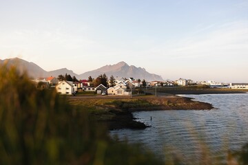 Coastal village with mountain backdrop