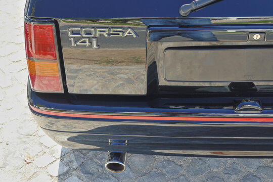 Opel corsa 1.4i rear showing chrome details and red striping