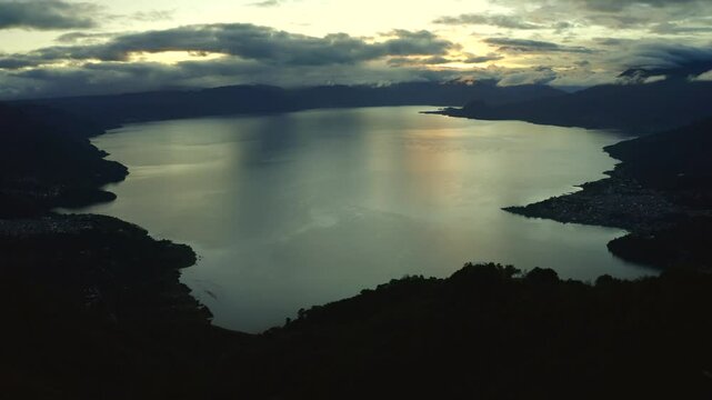 Early sunrise drone footage of lake atitlan in guatemala