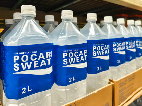 Row of Pocari Sweat bottles on a supermarket shelf
