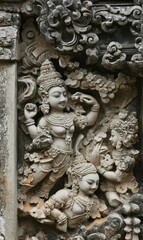 Ancient stone carvings of two figures.