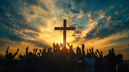 Large group at sunset on a hill, silhouetted against the sky by wooden cross. Orange to blue sky with clouds adds drama. Mountain range in background.