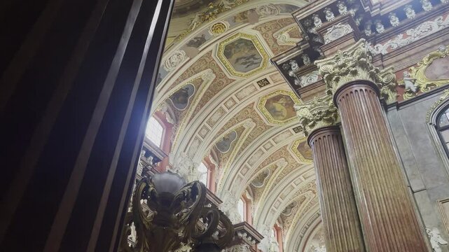 Delightful red baroque decoration on interior of Fara Church in Poznan, Poland