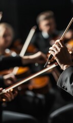 Fototapeta premium A hand holding a violin bow in the orchestra.