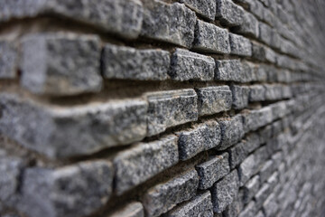 A brick wall with a gray color