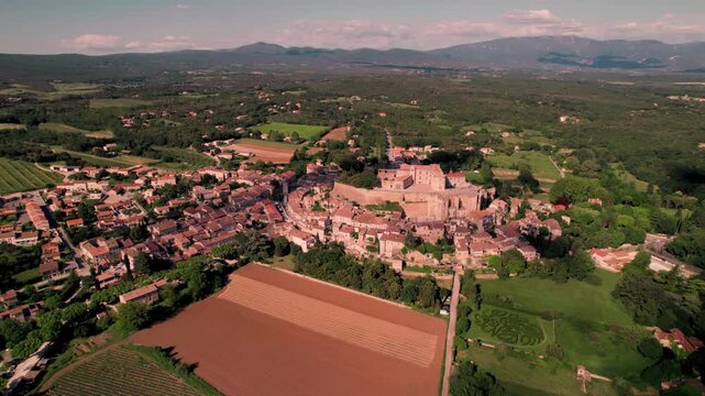 Aerial footage of Grignan commune on a sunny day in the Drome department, France
