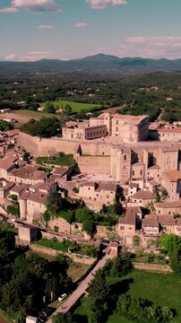 Vertical aerial footage of Grignan village in the Drome department on a sunny day, France