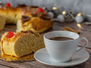 Cup of hot chocolate with a piece of Roscón de Reyes typical of Christmas 