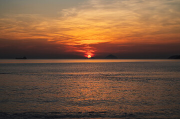 Fototapeta premium Amazing landscape with orange sunrise in the morning at sea in summer