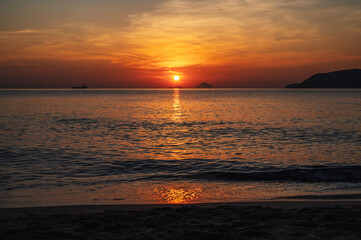 Beautiful landscape with orange sunrise in the morning at sea in summer