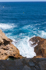 waves crashing on rocks