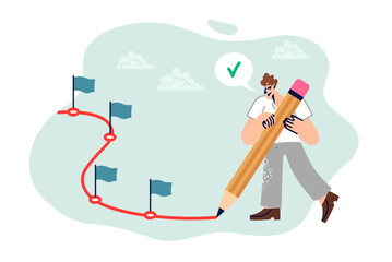 Man plans future by drawing route to move forward and setting small goals to achieve big goal