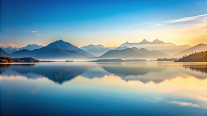 Fototapeta premium Minimalist Vertical Landscape of Serene Lake Surrounded by Majestic Mountains for Tranquil Nature Photography and Wall Art Decor