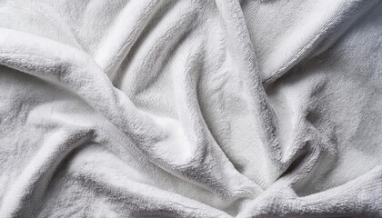 A clean and minimalist background featuring a smooth white fabric texture, ideal for showcasing products or text