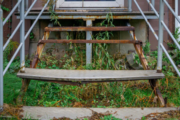old rusty stairs to an abandoned warehouse. © Adam