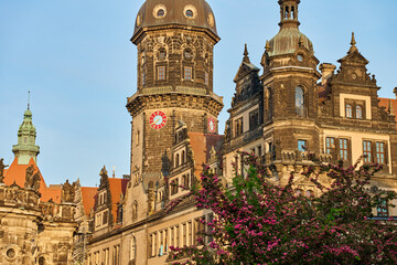 Obraz premium Dresden cathedral and Hausmannsturm tower at sunset. German architecture with historical building